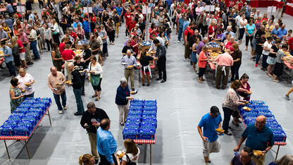 The crowd gathers to pick up their lunch at the Service Awards Celebration in the Coliseum, Sept. 18, 2019.