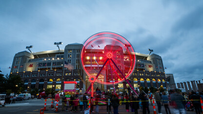 The Ferris wheel spins a Husker red pattern across Memorial Stadium in this long exposure image from the Cornstock Festival on Oct. 4. Nebraska's weeklong homecoming celebration was inspired by the university's 150th anniversary.