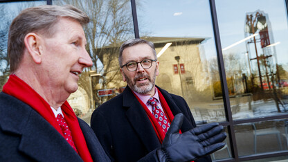 Ted Carter (left) and Ronnie Green talk outside of the East Campus Union during tour activities on Jan. 16.