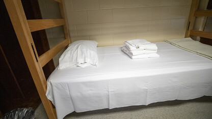 A bed is shown in a residence hall on the University of Nebraska–Lincoln campus.