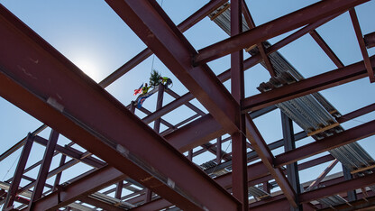 Hausmann Construction workers complete the installation of the final beam in the first phase expansion of College of Engineering facilities on Aug. 26.