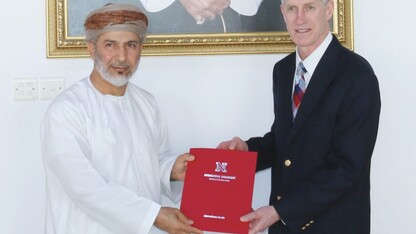 Abdulkarim Sultan Al Mughairi (left), dean of Oman Tourism College; and Timothy Carr; chair of UNL's Department of Nutrition and Health Sciences; hold a memorandum of understanding to facilitate academic collaboration between the institutions. 