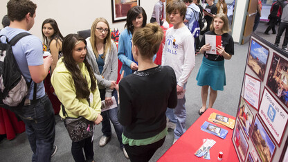 High school students listen to a presentation at the study abroad booth during the 2014 Modern Language Fair. The 2016 Modern Language Fair will be April 14 at the Nebraska Union.