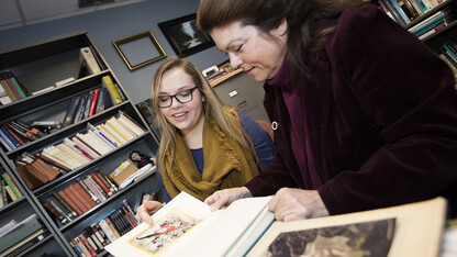 Student Amzie Dunekacke (left) works with Laura White, Weaver Professor of English at Nebraska, on a UCARE project in 2016. Eighty-eight Nebraska students have earned stipends to participate in research with faculty members this summer.