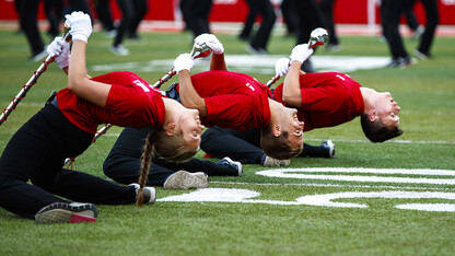 The drum majors take a bow before the Cornhusker Marching Band exhibition Aug. 17 at Memorial Stadium.