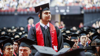 Juan Dominguez Jr. stands to be recognized along with other ROTC members of the graduating class during the morning undergraduate commencement ceremony May 4 at Pinnacle Bank Arena. He was commissioned a second lieutenant in the U.S. Army on May 4.