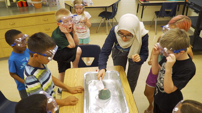 Nora Husein of Lincoln conducts a science experiment during her after-school club in 2019.