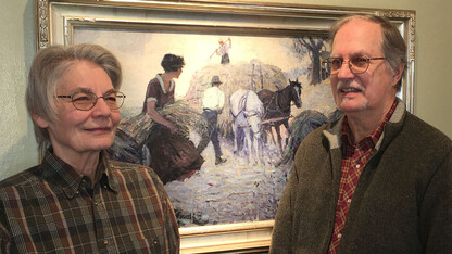 Carol and Mark Moseman of David City, Nebraska, with “Fighting Blood,” a painting by Frank L. Spradling (1885–1972).