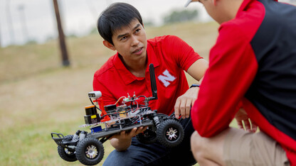 Hoang-Dung Tran, assistant professor of computer science and engineering, discusses a programmable vehicle at the NIMBUS lab on Nebraska Innovation Campus on Oct. 6. 