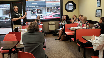 Jonathan Jank, president and CEO of the Seward County Chamber and Development Partnership, speaks at the Sunrise Bakery in McCook during the 2019 CEC Conference.