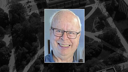 Color portrait of Donald H. Steinegger on black campus background