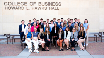 The 34 new Clifton Builders pose for a photo west of Howard L. Hawks Hall.