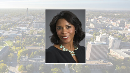 Color portrait of Renee Bowen on color campus background