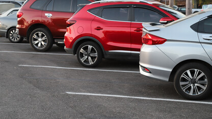 A row of vehicles parked diagonally