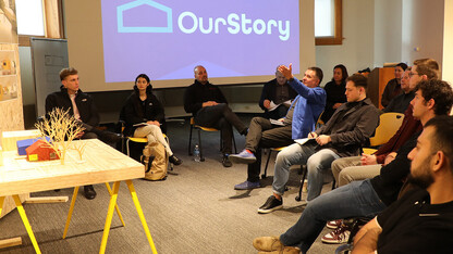 Graduates students in the FACT studio listen to feedback during their final project reviews.