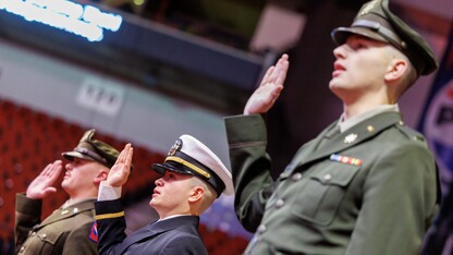 Three members of the University of Nebraska–Lincoln's Reserve Officer Training Corps, in uniform, recite the oath of enlistment during the undergraduate commencement ceremony Dec. 21 at Pinnacle Bank Arena.