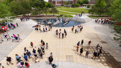 Parents and incoming students break into groups on the Nebraska Union Plaza as the afternoon session of New Student Enrollment begins on June 24.
