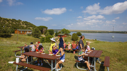 Campers complete art projects near Lake Olgallala at Cedar Point Biological Station.