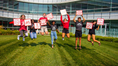 BRRWB volunteers pose with the dimensions of well-being that are promoted in the program to provide a framework for exploration and balance.