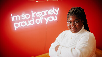 Odelia smiles for a photo in the College of Journalism's Experience Lab