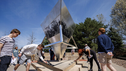 Students place rocks on the Holocasut Memorial. In Jewish cemeteries the tradition is to place rocks on the grave rather than flowers. History of the Holocaust course students visit the Holocaust memorial in Lincoln’s Wyuka Cemetery.