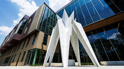 T.I.E. sculpture stands in front of Carolyn Pope Edwards Hall