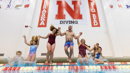 Kevin Van Den Wymelenberg jumps into the campus rec pool with his family.