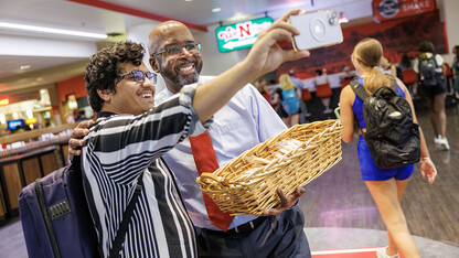 Chancellor Rodney Bennett poses with Rashedul Hasan during the chancellor’s cookie give-away Monday morning.