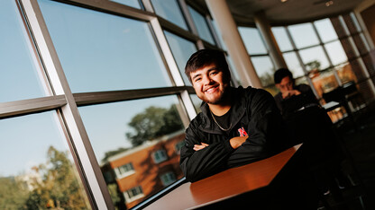 Isaac Perez smiles for a photo in the Jackie Gaughan Multicultural Center