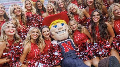 Herbie poses with the Cheer Squad during the home opener for the Husker football team.