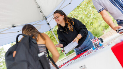 Maggie Nielsen with Husker Vote helps register students on National Voter Registration Day.