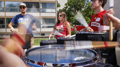 Gavin Gillespie (from left), Avryn Schardt, Liam Fitzgerald and other snare drums from the Cornhusker Marching Band took to Sheldon Sculpture Garden on Aug. 15 to play the first beats of the fall semester.