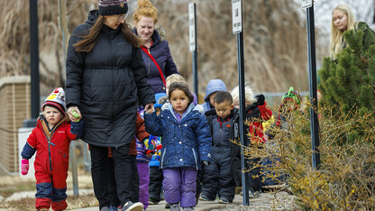 Mollie Von Kampen leads the children on a field trip.