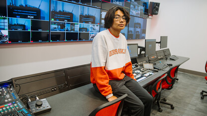 Jay Quemado is photographed in the broadcasting studio.