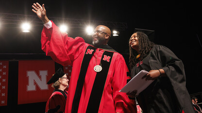 Chancellor Rodney D. Bennett waves to family and friends of Moriah Brown, a civil engineering masters graduate from Knoxville, Tennessee, during commencement exercises on May 17 in Pinnacle Bank Arena. Bennett and Brown are both from Knoxville, and the chancellor knows her aunts.