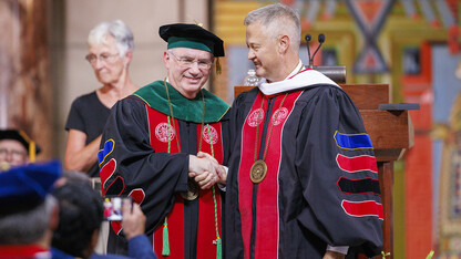 Dr. Jeffrey P. Gold, NU system president, shakes hands and accepts congratulations from Robert Schafer, president of the Board of Regents, during the Sept. 5 investiture in the Nebraska State Capitol Building. Gold is the ninth president of the NU system.