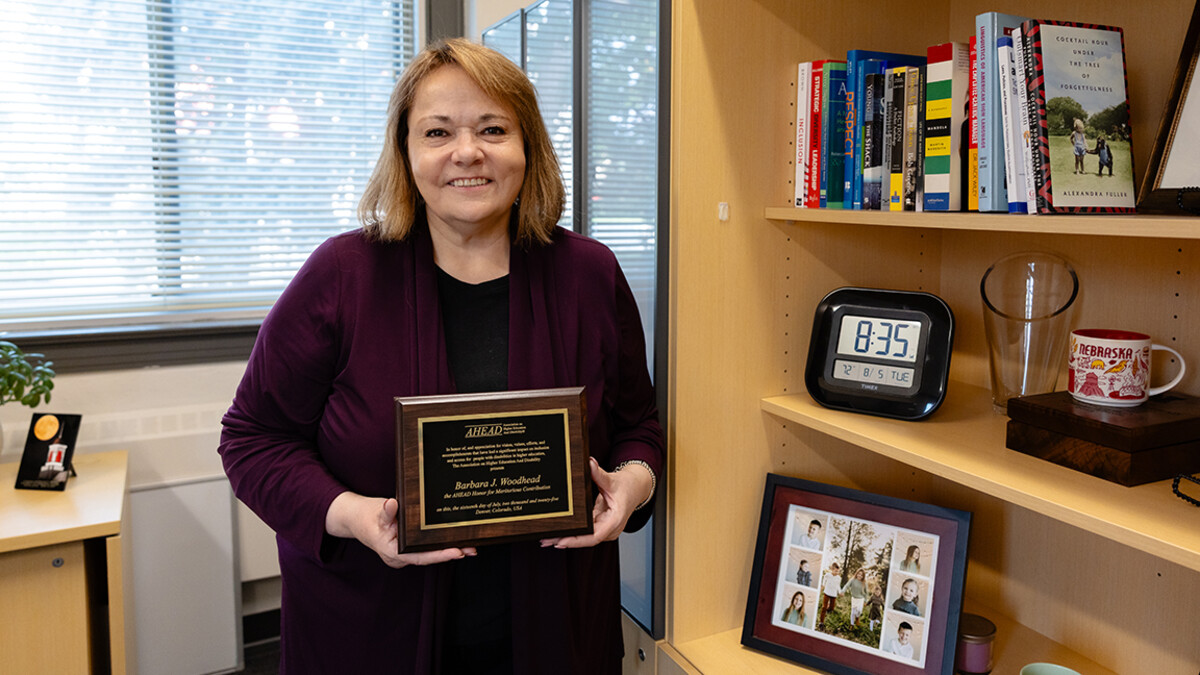 Barbara Woodhead stands in her office in Louise Pound Hall.