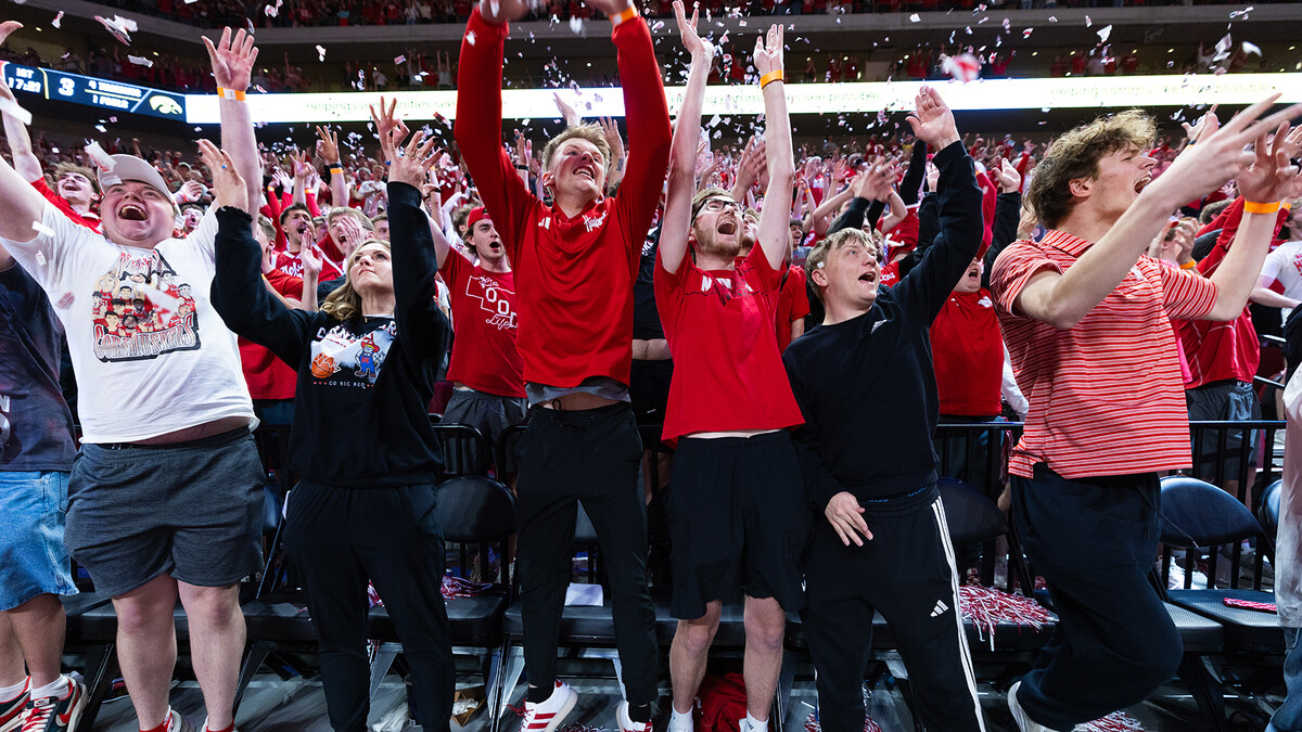 Fans through confetti in the air during the March 8 Husker men's basketball win over Iowa.
