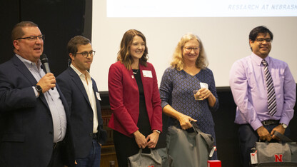 Bob Wilhelm, vice chancellor for the Office of Research and Economic Development, awaits the results of the Faculty Slam with participants Daniel Tennenbaum, Lisa Knoche, Margaret Jacobs and Prahalada Rao.