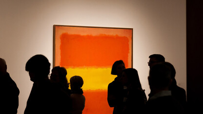 Visitors examine Mark Rothko's "Yellow Band," which is part of Sheldon Museum of Art's permanent collection.