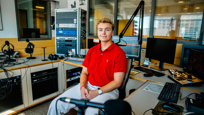 Schrantz, a junior sports media & communication and broadcasting double major from Orchard Park, NY, pictured here in the KRNU headquarters.  