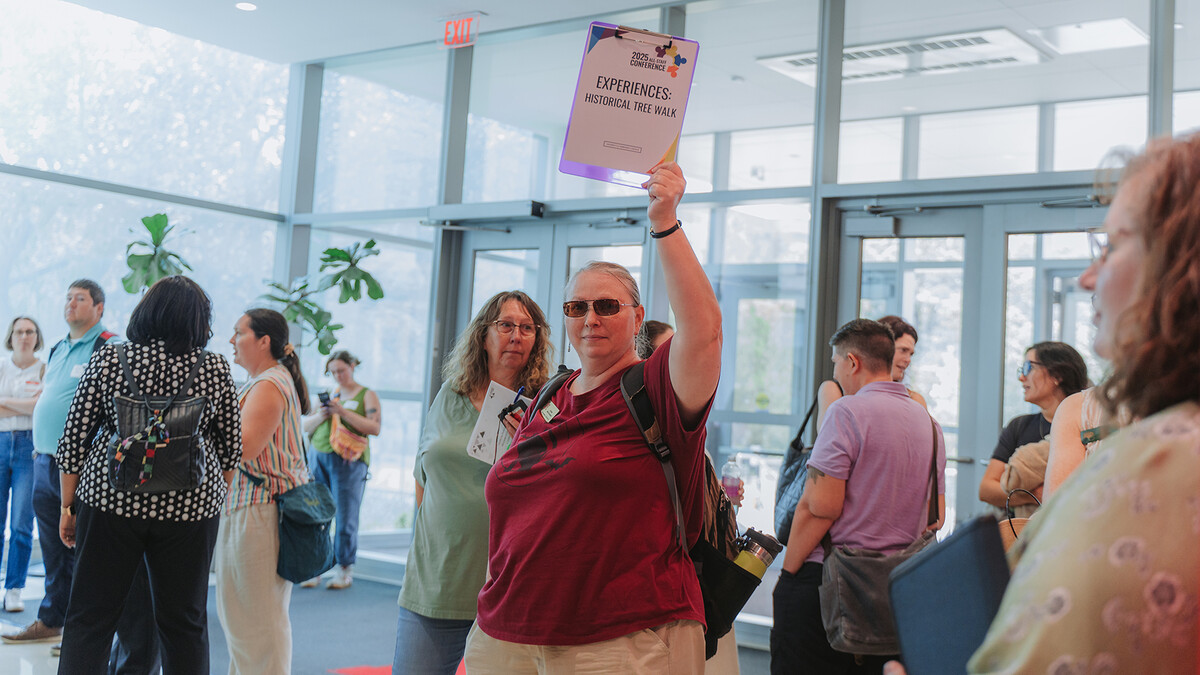 Woman leading a tour during an event.