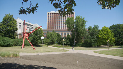 A student passes through UNL's Cather Garden on July 31. The south quadrant of the garden is being renovated this summer. The other parts of the space will be updated as part of the Love Library North Learning Commons project.