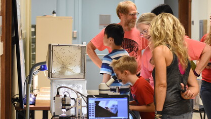 Dave Taylor explaining the secret life of flies to guest at BugFest 2017. (Courtesy of the Department of Entomology)