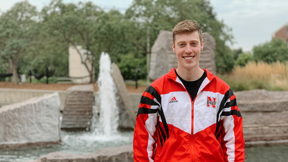 Jake Drake smiles for a photo in front of Broyhill Fountain