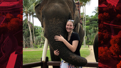 Nebraska's Emma Dolenshek embraces an elephant during a trip to Bali.