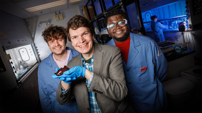 James Checco, Baba Yussif and Cole Blasing with a sea slug