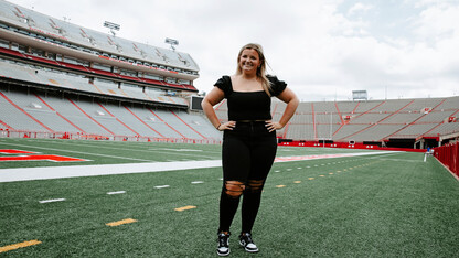 Gross on the field of Memorial Stadium. As a first-year sports media and communication major and intern with Husker Athletics, Meg is already garnering hands-on experience covering a variety of Husker sporting events.  