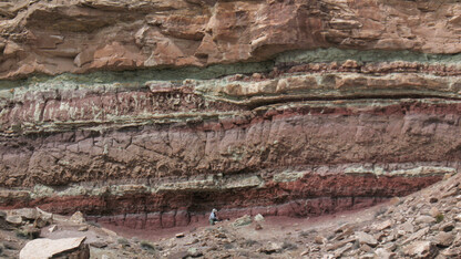 Matt Joeckel, Conservation and Survey Division director, is seen mapping the Yellow Cat Formation of the Cedar Mountain Formation in Utah. | Photo courtesy Jim Kirkland, Utah Geological Survey
