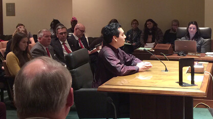 Seth Marshall, a junior journalism major, testifies in front of the Nebraska Legislature's Appropriations Committee as Chancellor Ronnie Green and NU Regent Tim Clare look on. Marshall is a first-generation student who is paying his own way through college. He told the committee that proposed state budget reductions could put a university education out of his financial reach.